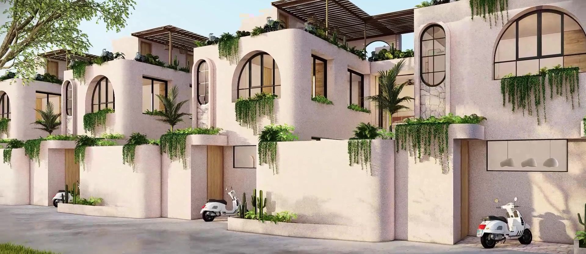 The row of Signature Villas along the private road, off-white curved walls, arched windows and rooftop pergolas